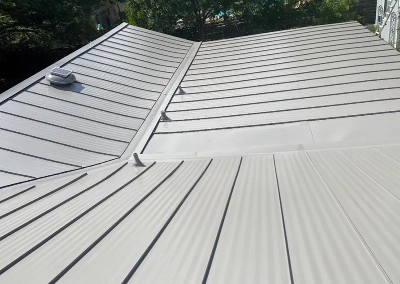 Solar attic fan installed on a metal roof for Roof Ventilation in Eden Prairie